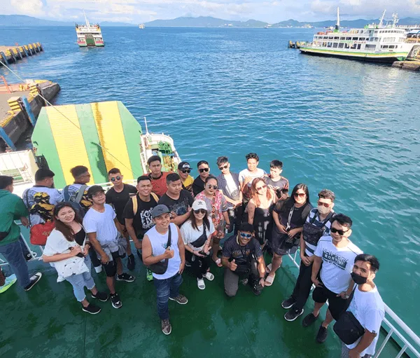 ATOM team members aboard a ferry during a company outing
