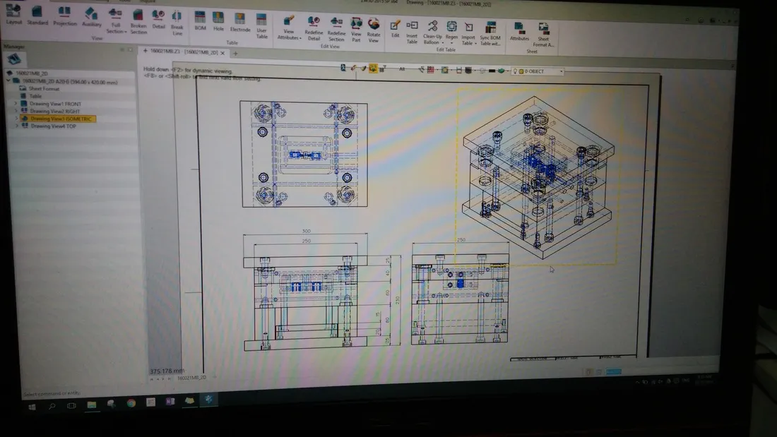 Reviewing 2D and isometric CAD drawings of a custom mold design